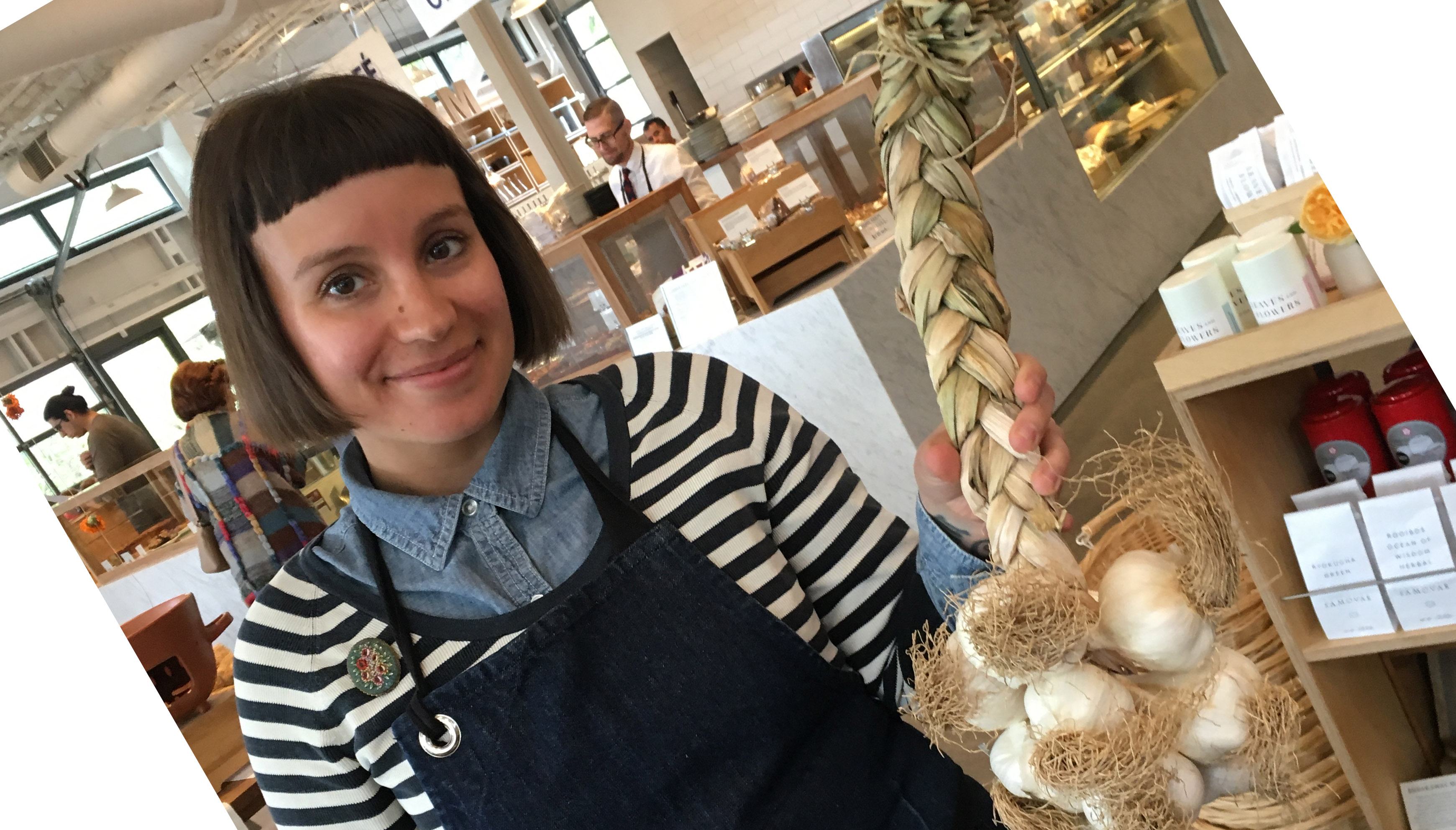 Meg Rottinghaus at Healdsburg SHED holding Yael’s braided garlic